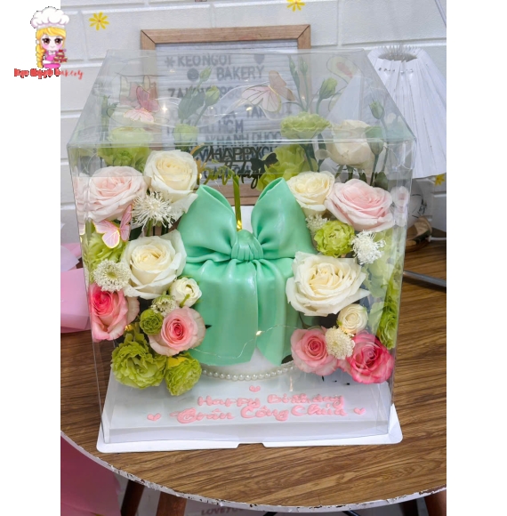 Bánh kem nơ xinh hoa tươi tone xanh pastel